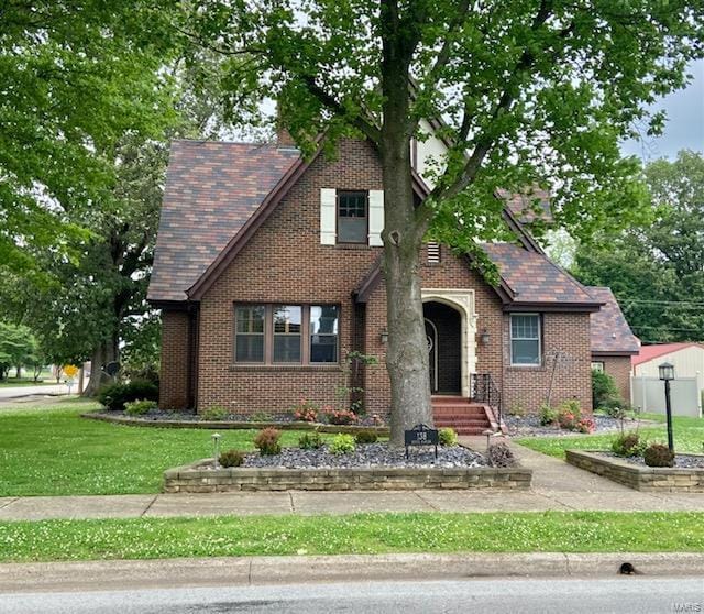 tudor home with brick siding