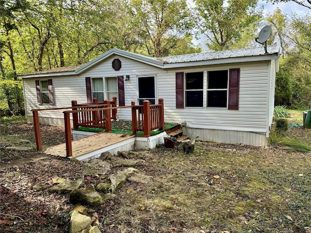 65 Bright St, Troy, MO 63379 - manufactured / mobile home with a deck and metal roof