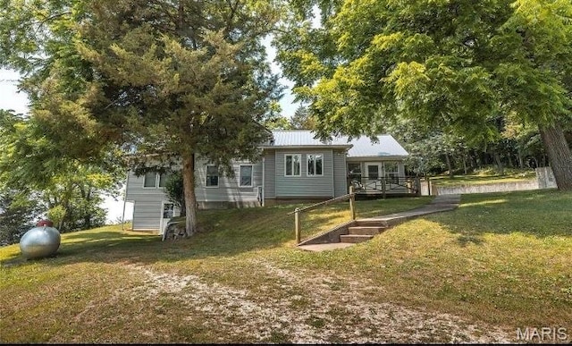 1 Golden Eagle Ferry Rd, Golden Eagle, IL 62036 - rear view of property with a yard and metal roof