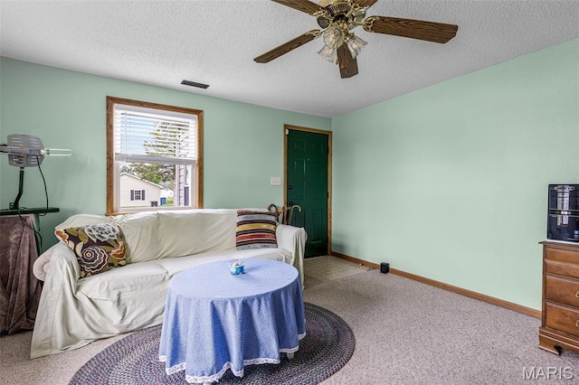 109 N Grant St, Desloge, MO 63601 - carpeted living room featuring a ceiling fan, a textured ceiling, and baseboards