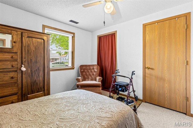 109 N Grant St, Desloge, MO 63601 - carpeted bedroom with a textured ceiling, baseboards, and ceiling fan