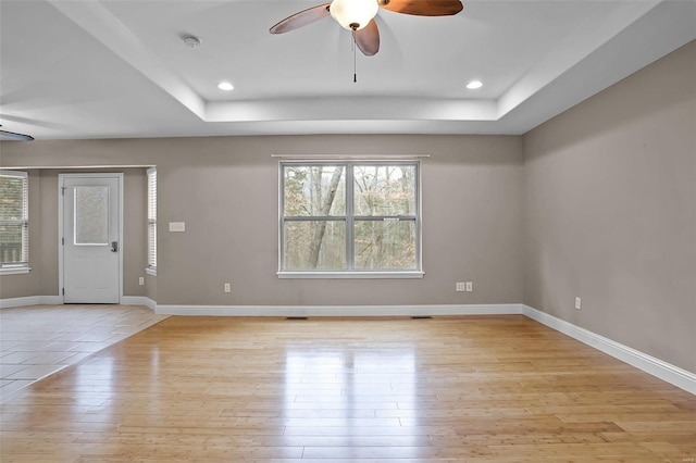 443 Mark Twain Loop, Union, MO 63084 - spare room with a ceiling fan, a tray ceiling, light wood-style flooring, a smoke detector, and recessed lighting