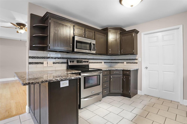 443 Mark Twain Loop, Union, MO 63084 - kitchen featuring stainless steel appliances, dark brown cabinetry, decorative backsplash, and a ceiling fan