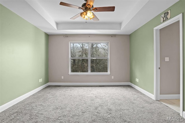 443 Mark Twain Loop, Union, MO 63084 - spare room featuring a raised ceiling, carpet floors, and a ceiling fan