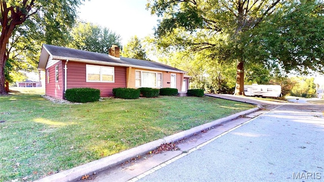 4645 S State Route 159, Glen Carbon, IL 62034 - ranch-style house with a chimney and a front lawn