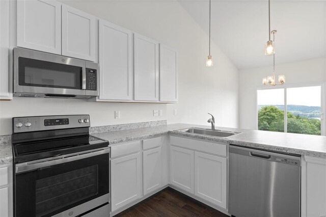 2491 Chukka Dr, Eureka, MO 63025 - kitchen with stainless steel appliances, a sink, white cabinets, and dark wood-style flooring