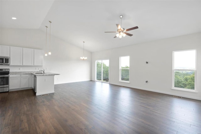 2491 Chukka Dr, Eureka, MO 63025 - unfurnished living room with a sink, ceiling fan, dark wood-type flooring, a chandelier, and high vaulted ceiling
