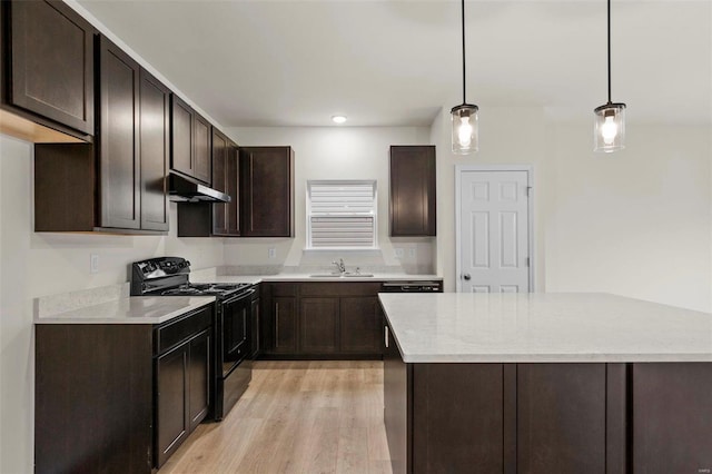 kitchen featuring black electric range oven, a sink, dark brown cabinets, light wood-style flooring, and under cabinet range hood