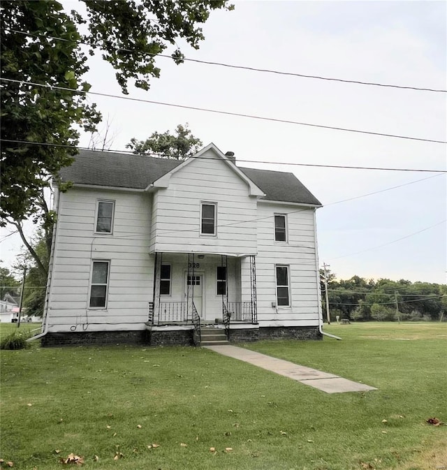 328 W Orrick, La Plata, MO 63549 - traditional home featuring a porch and a front yard
