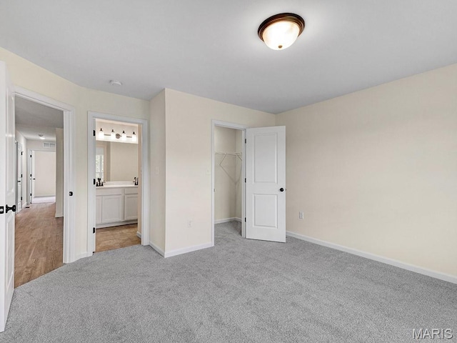 3136 White Pine Dr, Imperial, MO 63052 - unfurnished bedroom with carpet, a spacious closet, connected bathroom, and a closet