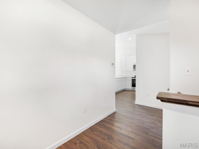 3128 White Pine Dr, Imperial, MO 63052 - empty room with dark wood finished floors, recessed lighting, and vaulted ceiling
