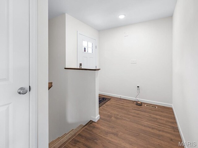 3128 White Pine Dr, Imperial, MO 63052 - laundry area with wood finished floors and baseboards