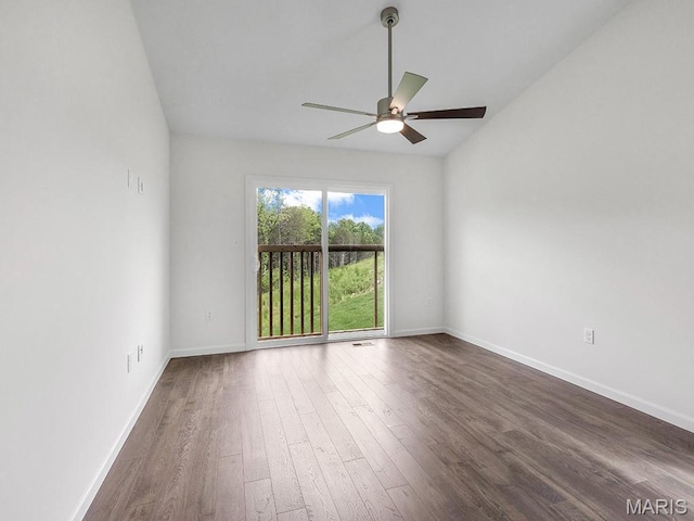 3128 White Pine Dr, Imperial, MO 63052 - spare room featuring ceiling fan, dark wood-style flooring, and vaulted ceiling