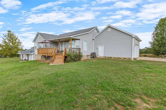 8041 Greystone Ln, Bonne Terre, MO 63628 - back of property with an attached garage, a yard, driveway, central AC unit, and a wooden deck