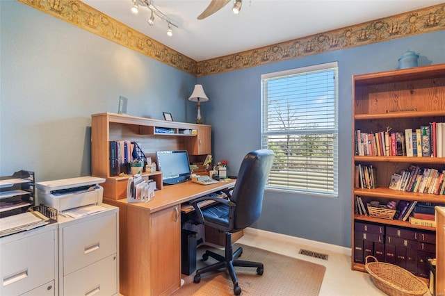 8041 Greystone Ln, Bonne Terre, MO 63628 - home office featuring a ceiling fan, baseboards, light carpet, and rail lighting