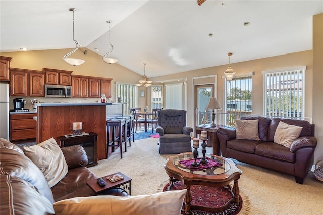8041 Greystone Ln, Bonne Terre, MO 63628 - living area with light carpet, vaulted ceiling, and a chandelier