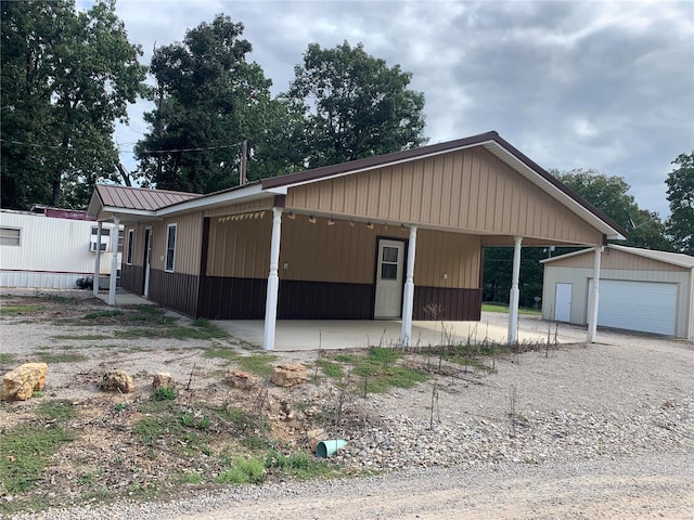 1099 Beverly Dr, Wappapello, MO 63966 - view of front facade featuring an outdoor structure, a garage, and metal roof