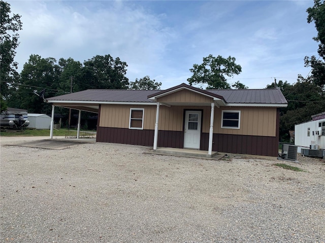 1099 Beverly Dr, Wappapello, MO 63966 - view of front of home featuring central AC unit, metal roof, and covered porch
