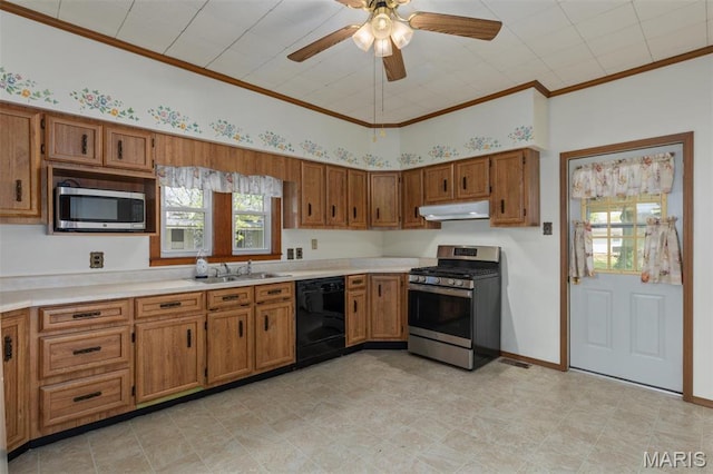 823 E Pearl St, Staunton, IL 62088 - kitchen featuring stainless steel appliances, under cabinet range hood, brown cabinets, a sink, and crown molding