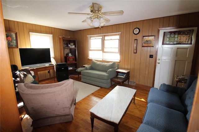 932 State Highway Hh, Isabella, MO 65676 - living area featuring wood finished floors, ceiling fan, and wooden walls