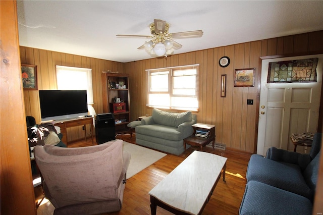 932 State Highway Hh, Isabella, MO 65676 - living room with a ceiling fan, wood walls, and wood finished floors