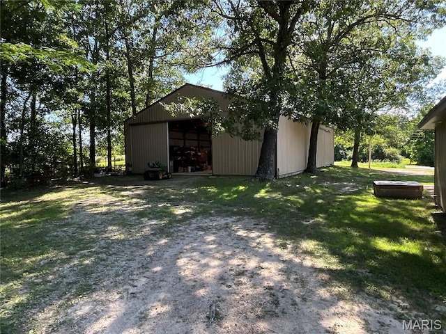 932 State Highway Hh, Isabella, MO 65676 - view of green lawn with a detached garage, an outbuilding, and a pole building