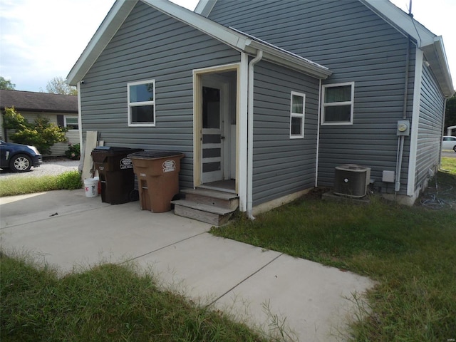 1103 S Madison St, Gillespie, IL 62033 - back of property with a patio area and central AC