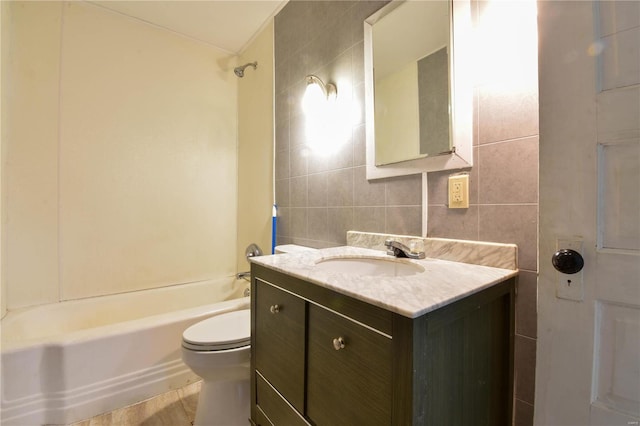 1103 S Madison St, Gillespie, IL 62033 - full bathroom featuring toilet, tile walls,  shower combination, and vanity