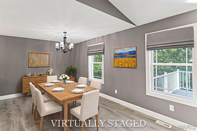 1127 Redwing Ct, Grafton, IL 62037 - dining space with a chandelier and wood finished floors