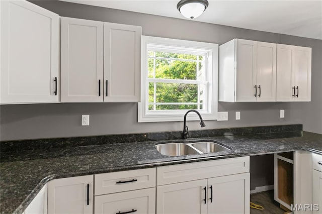 1127 Redwing Ct, Grafton, IL 62037 - kitchen featuring white cabinetry and dark stone countertops