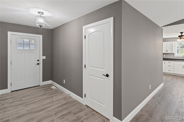 1127 Redwing Ct, Grafton, IL 62037 - entryway with light wood-style floors and a ceiling fan