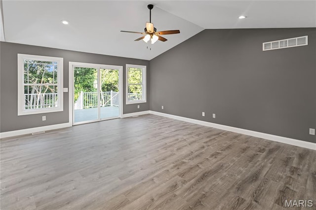 1127 Redwing Ct, Grafton, IL 62037 - empty room featuring ceiling fan, vaulted ceiling, wood finished floors, and recessed lighting
