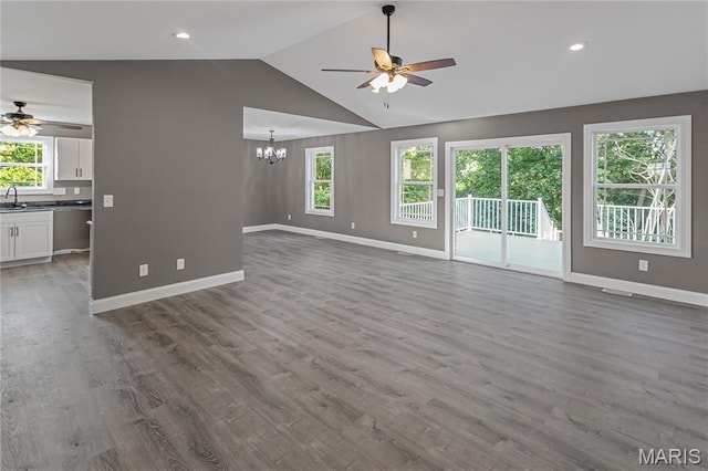 1127 Redwing Ct, Grafton, IL 62037 - unfurnished living room with a ceiling fan, a chandelier, vaulted ceiling, wood finished floors, and recessed lighting