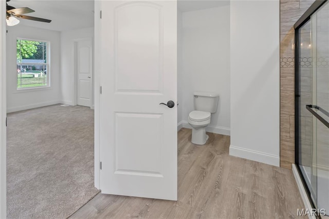 1127 Redwing Ct, Grafton, IL 62037 - full bath featuring a shower stall, a ceiling fan, and wood finished floors