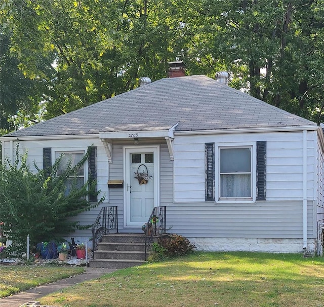 2709 Ralph St, Granite City, IL 62040 - view of front of property featuring a shingled roof, a front yard, and a chimney