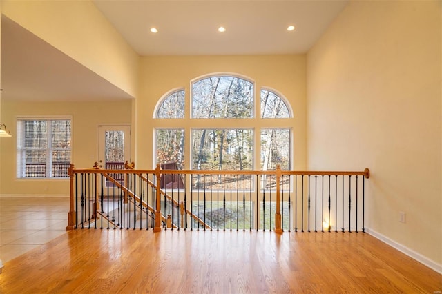 814 Marti Dr, Rolla, MO 65401 - bonus room featuring healthy amount of natural light, wood finished floors, recessed lighting, baseboards, and a high ceiling