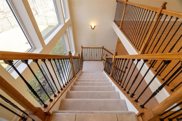 814 Marti Dr, Rolla, MO 65401 - stairs featuring a towering ceiling and healthy amount of natural light