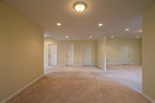 814 Marti Dr, Rolla, MO 65401 - spare room with light carpet, baseboards, and recessed lighting