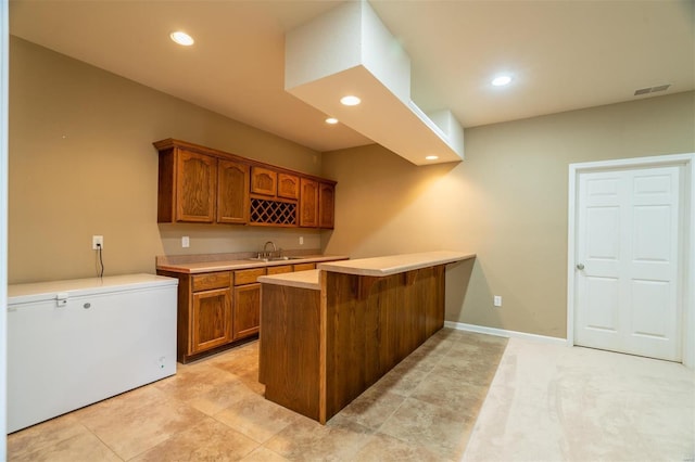 814 Marti Dr, Rolla, MO 65401 - indoor wet bar featuring fridge, recessed lighting, and baseboards