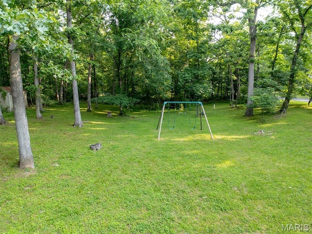 814 Marti Dr, Rolla, MO 65401 - view of green lawn with a playground