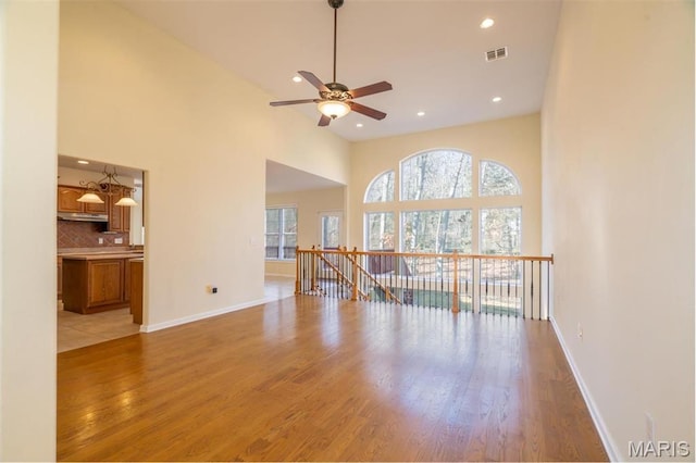 814 Marti Dr, Rolla, MO 65401 - unfurnished room with plenty of natural light, light wood finished floors, ceiling fan, recessed lighting, and baseboards