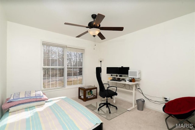 814 Marti Dr, Rolla, MO 65401 - carpeted bedroom featuring a desk, a ceiling fan, and baseboards