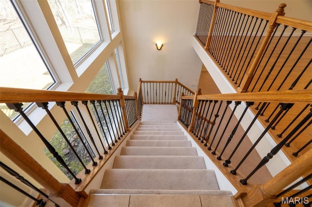 814 Marti Dr, Rolla, MO 65401 - staircase featuring a towering ceiling and healthy amount of natural light