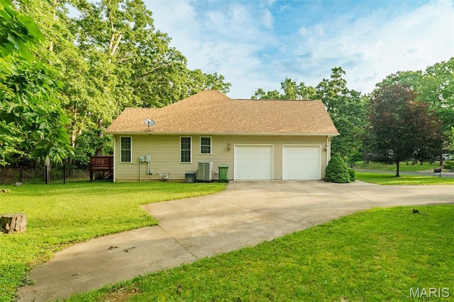 814 Marti Dr, Rolla, MO 65401 - view of side of property with an attached garage, driveway, and central AC