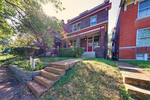 3834 De Tonty St, Saint Louis, MO 63110 - view of front facade featuring brick siding and covered porch
