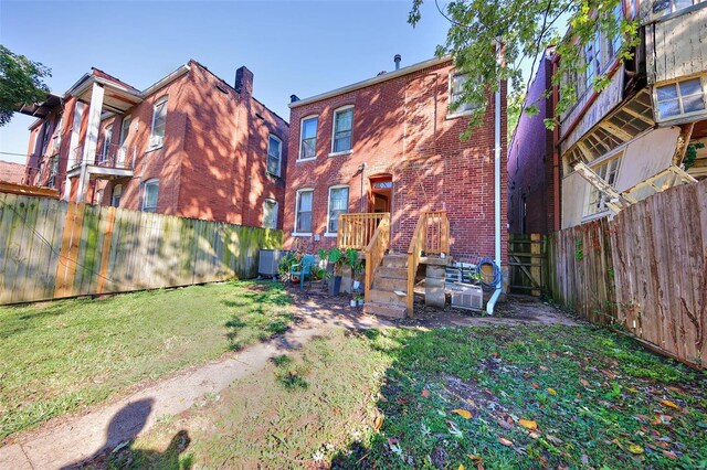 3834 De Tonty St, Saint Louis, MO 63110 - rear view of house featuring brick siding