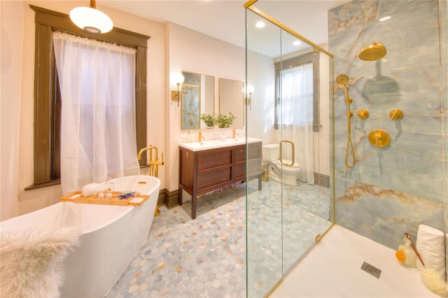 3834 De Tonty St, Saint Louis, MO 63110 - bathroom featuring a shower stall, vanity, a soaking tub, recessed lighting, and toilet