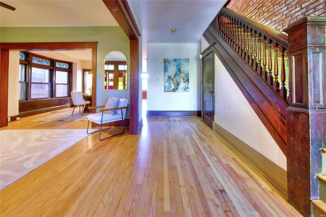 3834 De Tonty St, Saint Louis, MO 63110 - foyer entrance featuring baseboards, stairs, and wood finished floors
