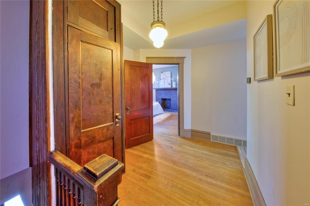 3834 De Tonty St, Saint Louis, MO 63110 - hall with light wood-style floors and baseboards
