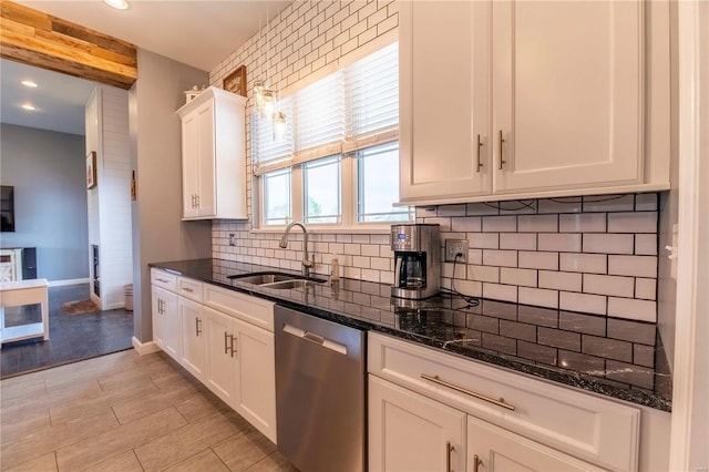 101 Lauren Grace Ct, Elsberry, MO 63343 - kitchen featuring dishwasher, a sink, backsplash, white cabinetry, and dark stone countertops
